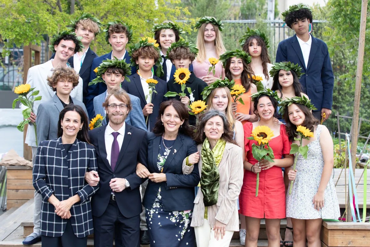 The graduating class together on campus