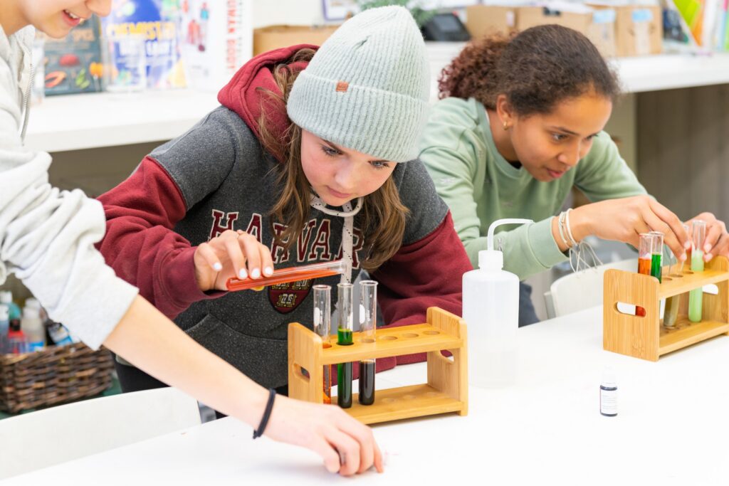 Two students running an experiment in science class