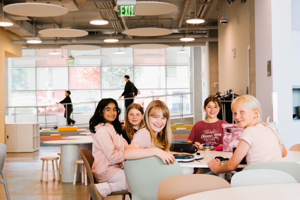 Students gathered on the lounge seating in the atrium
